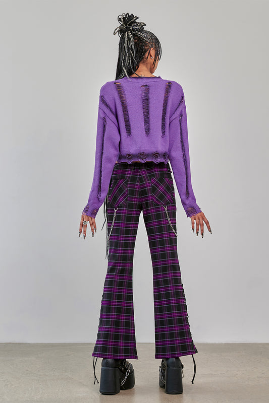 Model wearing Banned Apparel Purple Tartan Trousers scarlett vixen back view flared alternative tartan trousers