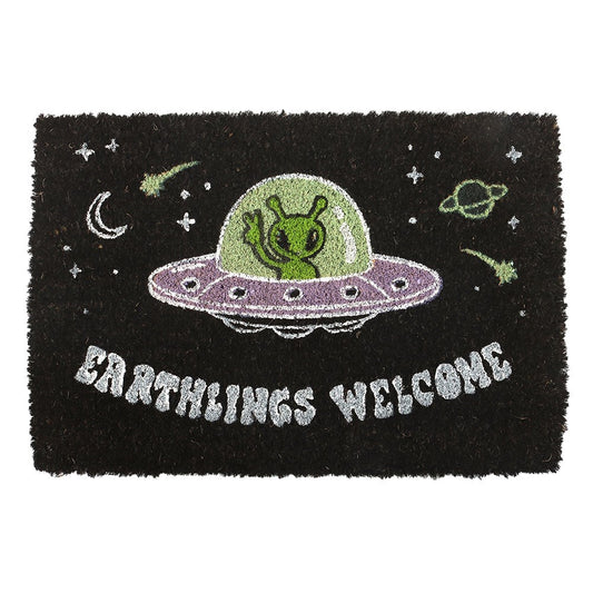 Gothic Gifts Earthlings Welcome Alien Doormat with playful green alien in a purple UFO on a black background.