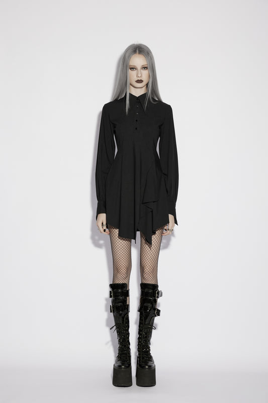 Punk Rave Nyx Asymmetrical Shirt Dress worn by a model, featuring dark romantic style and edgy footwear.