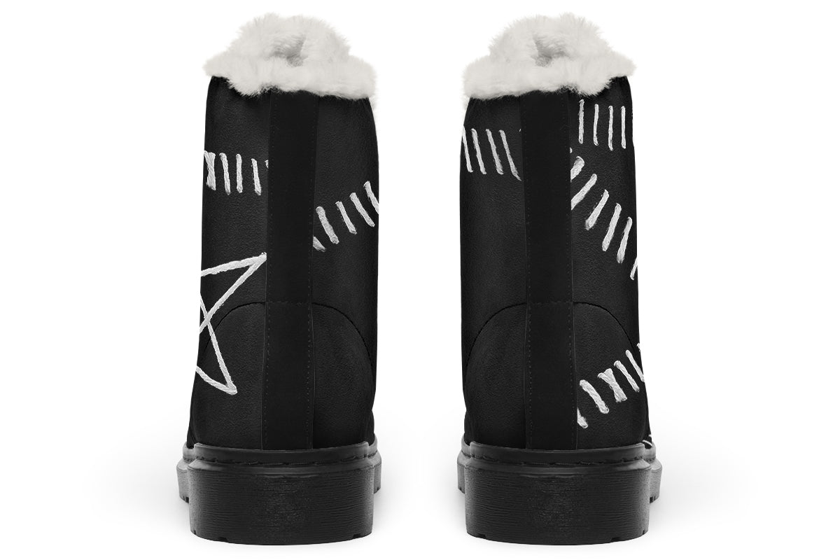 Black boots with white patterns and fur lining on a white background