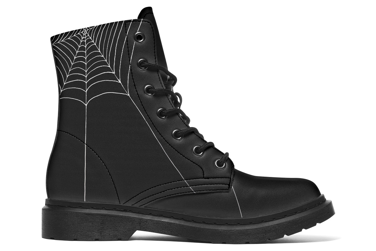 Black boot with spider web pattern on a white background