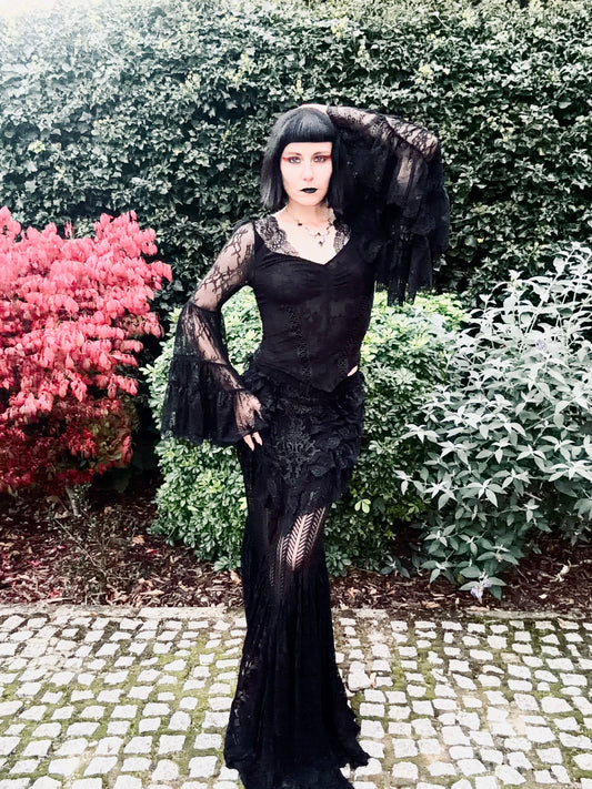Julia Rose Noir wearing the Punk Rave Rowena Gothic Fishtail Maxi Skirt with the Dark in Love Zuri Gothic Bell Sleeve Top showcasing the lace belled sleeves