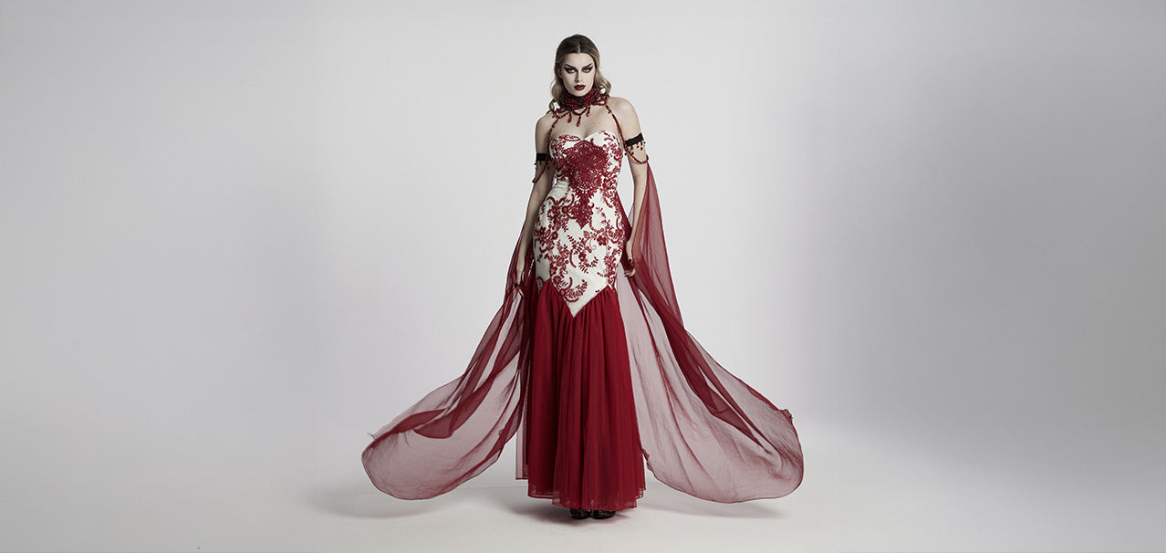 New gothic clothing arrivals – woman in blood red ball gown and mesh cloak