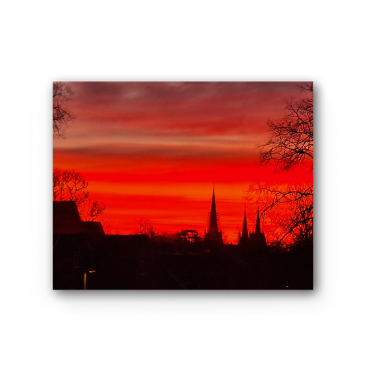 The Ember Hour premium stretched canvas with red sunset skyline