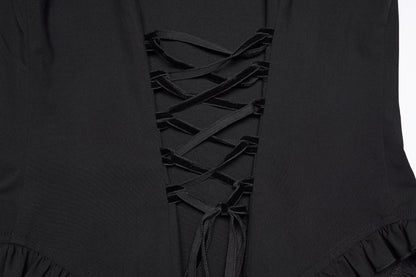 Detailed view of the goth ruffle shirt's lace-up design and ruffled hemline.