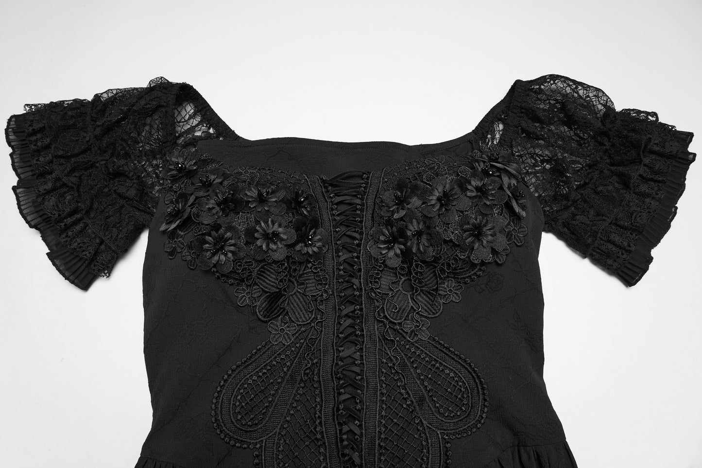 Detail of the goth maxi dress featuring lace accents and floral embellishments on the bodice.