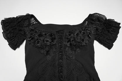 Detail of the goth maxi dress featuring lace accents and floral embellishments on the bodice.