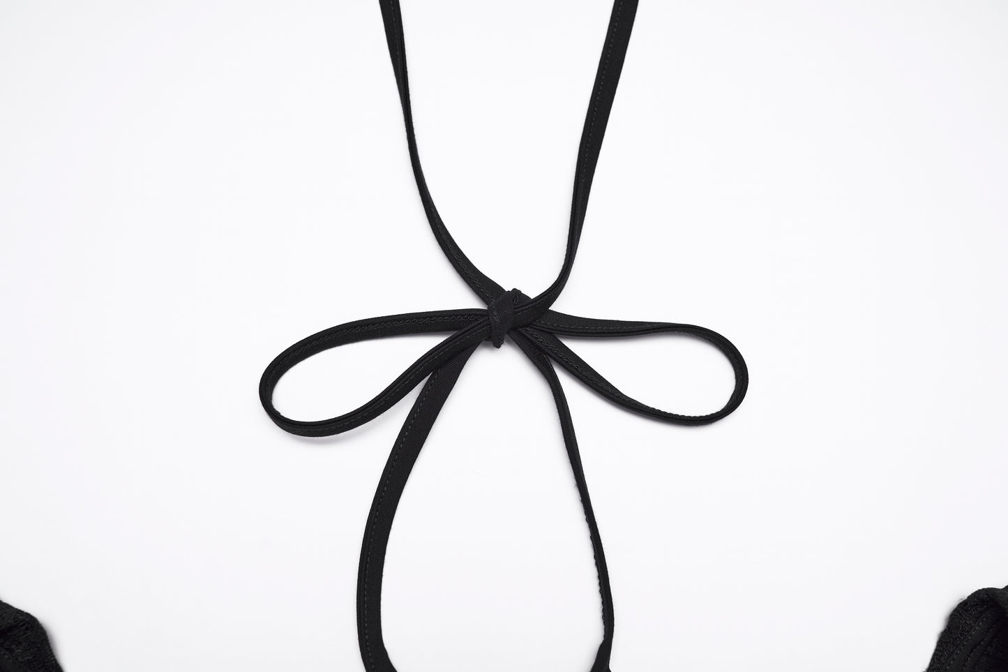 Close-up of the back detail of the Punk Rave Morrigan goth flying sleeve dress featuring a black ribbon tie.