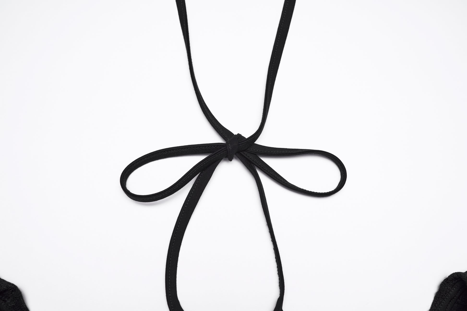 Close-up of the back detail of the Punk Rave Morrigan goth flying sleeve dress featuring a black ribbon tie.
