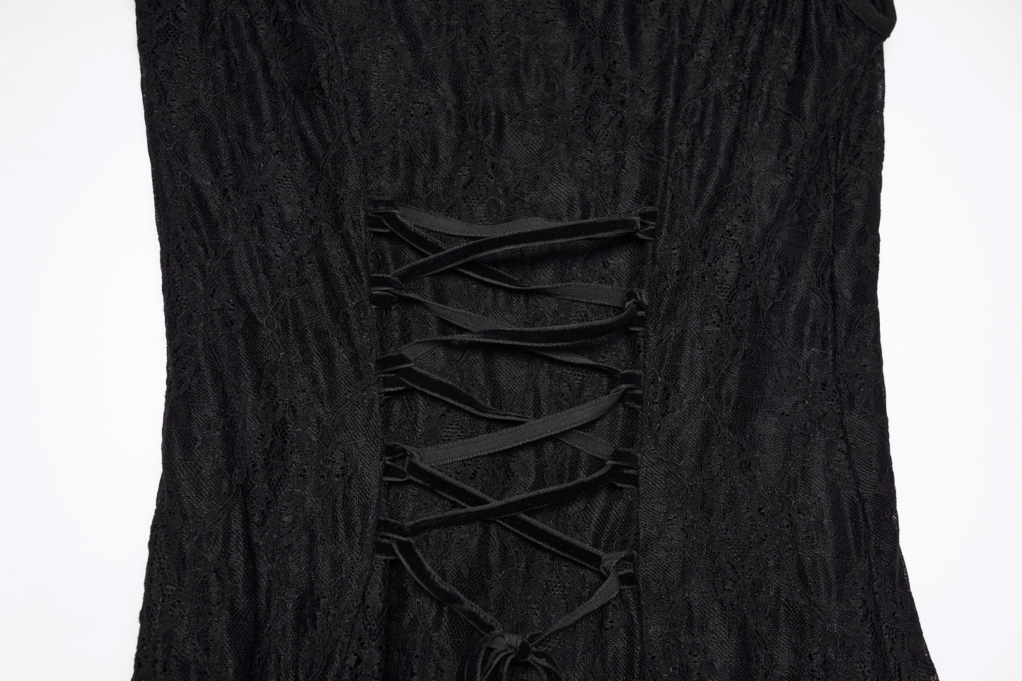 Close-up of the back detail of a goth flying sleeve dress with lace-up design in black fabric.
