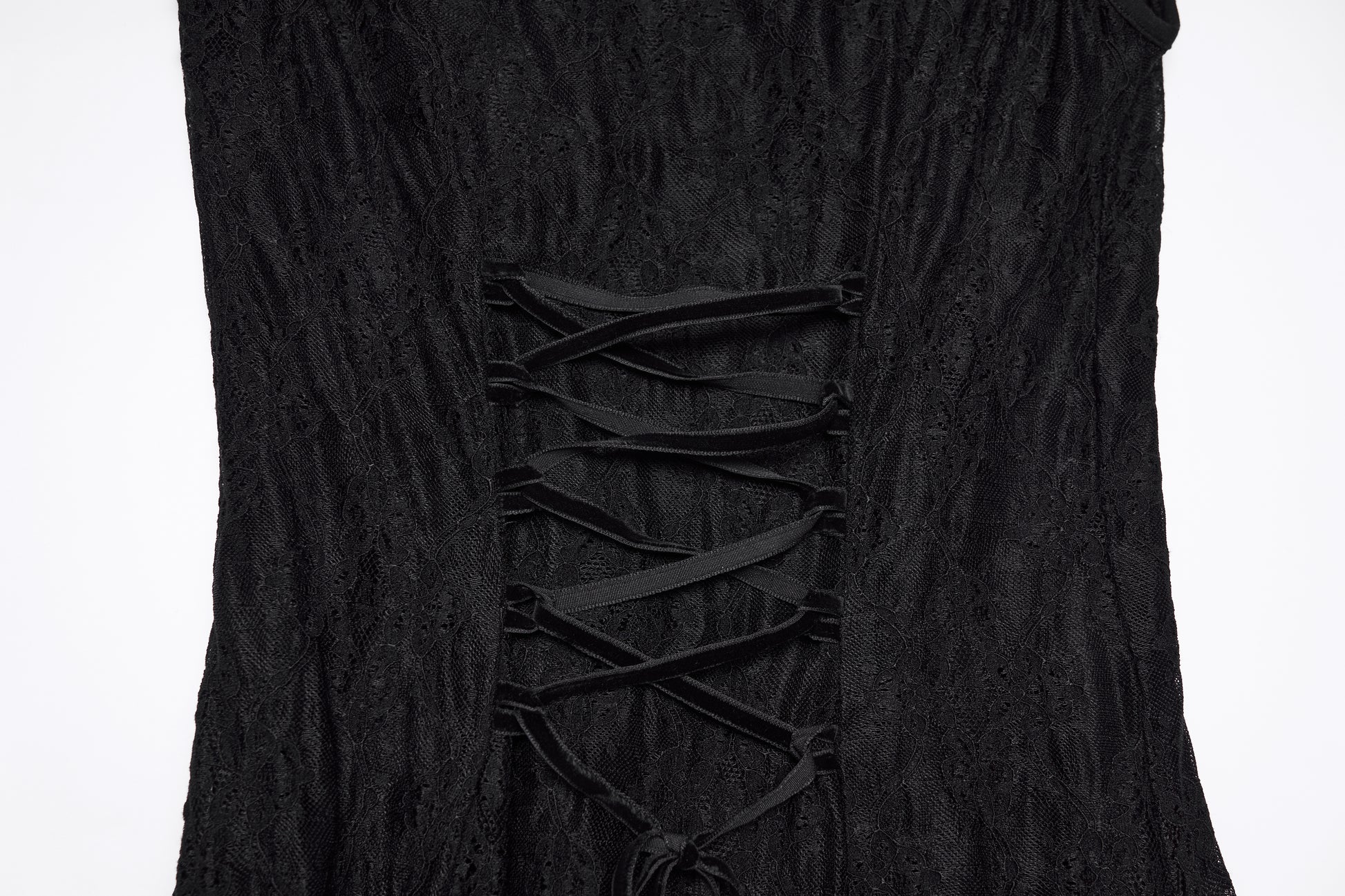 Close-up of the back detail of a goth flying sleeve dress with lace-up design in black fabric.