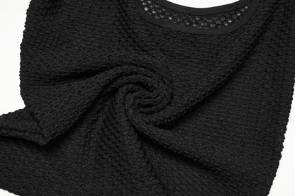 Close-up of a black mesh goth camisole showcasing textured fabric and a sleek design.
