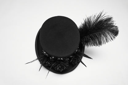 Goth feather formal hat with feather and floral embellishments, perfect for alternative fashion. Bold and dramatic styling.