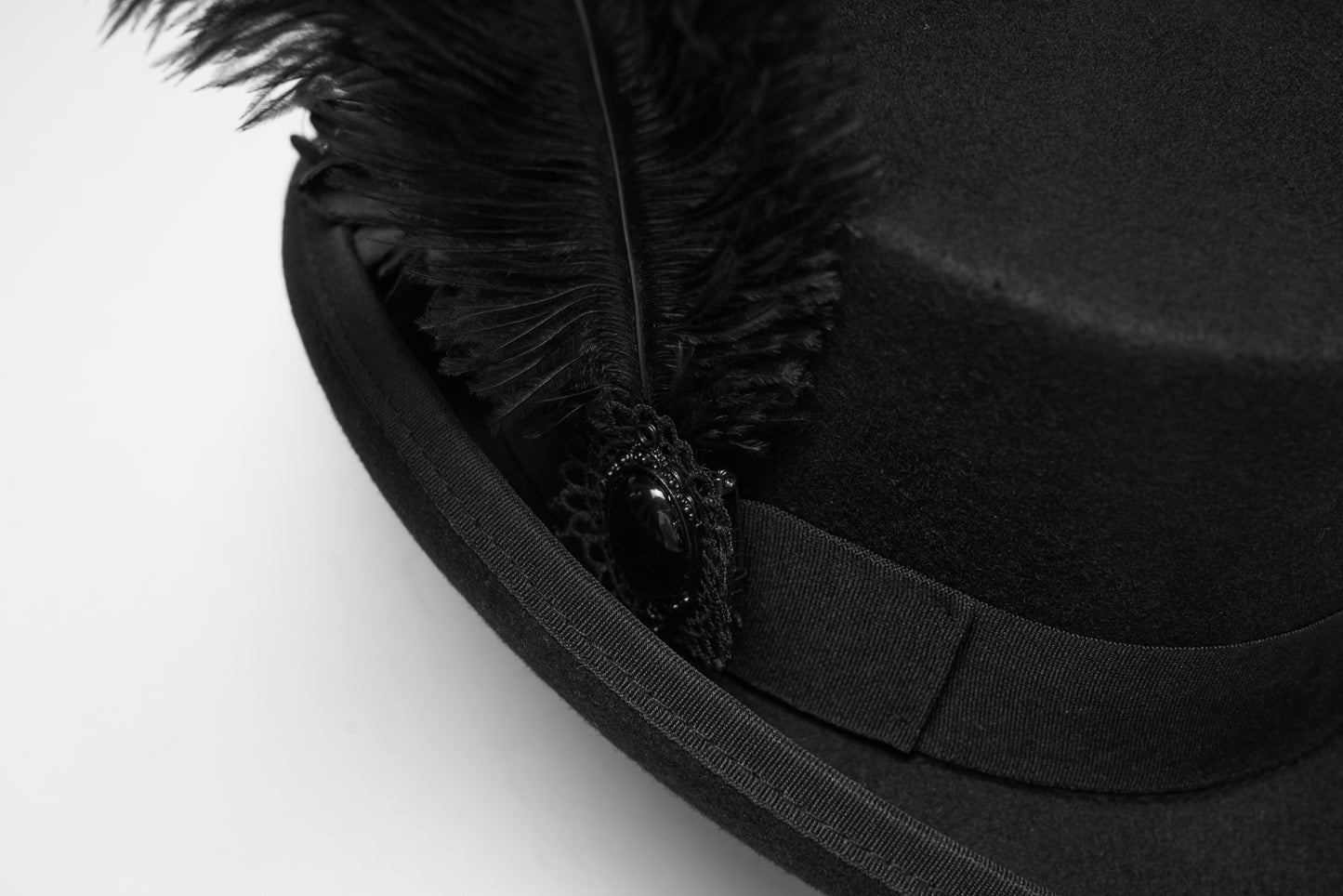 Goth feather formal hat with intricate floral embellishments and dramatic feather details.