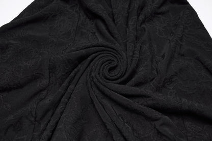 Textured jacquard fabric in black, showcasing the intricate pattern perfect for Punk Rave Seraphina Jacquard Halter Fish Tail Dress.