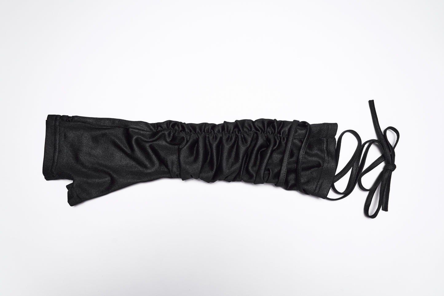 Goth fingerless strap gloves showing layered pleated fabric and tie detail, ideal for a punk style.