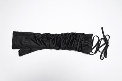Goth fingerless strap gloves showing layered pleated fabric and tie detail, ideal for a punk style.