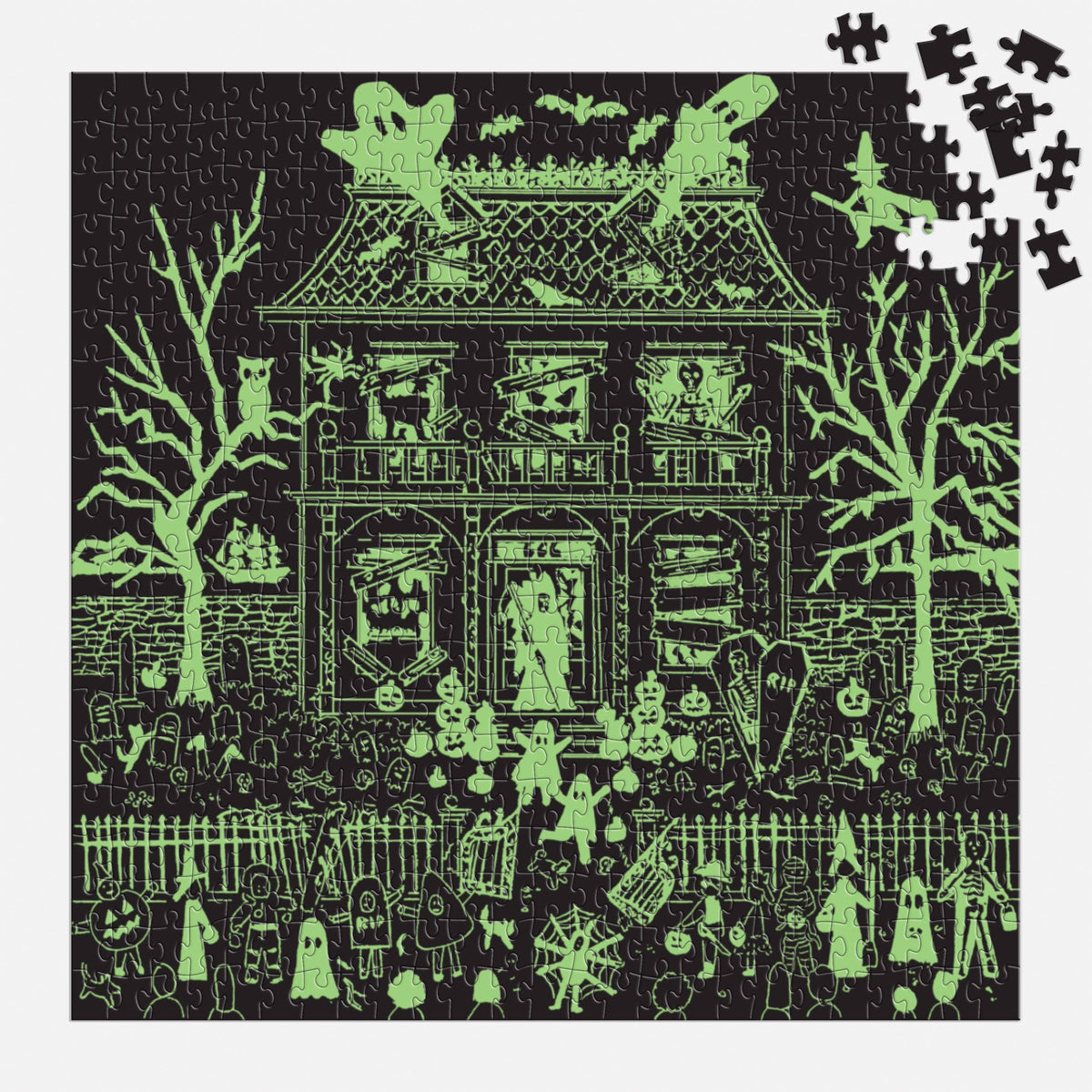 The same puzzle in the dark, with the house, trees and figures glowing green.