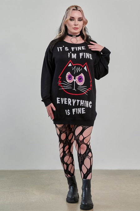 Gothic Jumper Dress with cartoon cat graphic, worn with fishnet leggings, showcasing alternative fashion style.