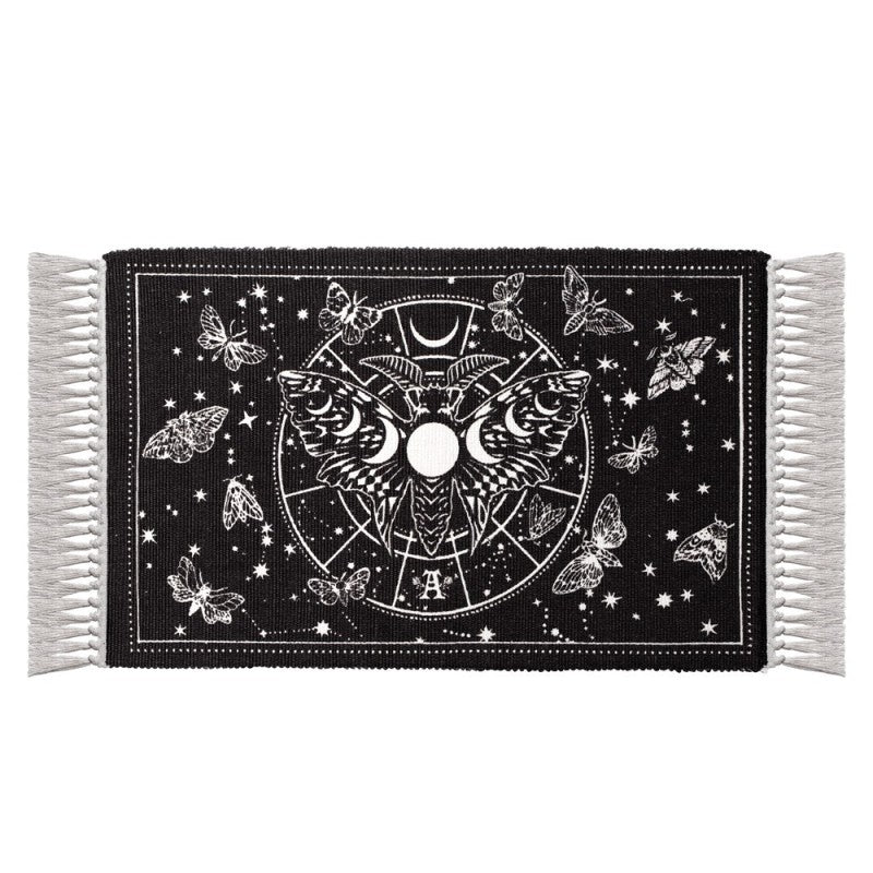 Lunar Moth Rug featuring a luna moth, moon phases, and celestial designs on a black background.