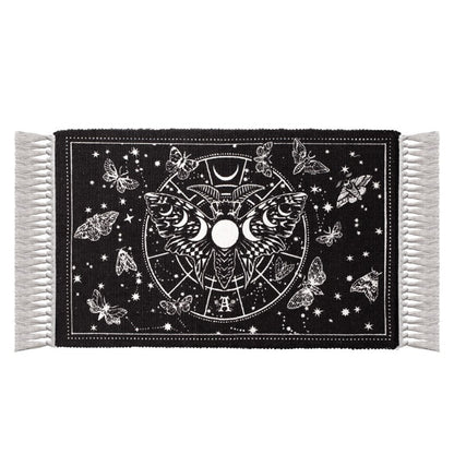 Lunar Moth Rug featuring a luna moth, moon phases, and celestial designs on a black background.