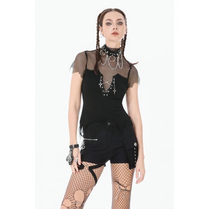 Person wearing a black outfit with fishnet sleeves and tights on a white background