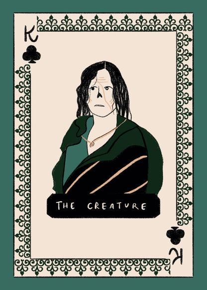 Frankenstein deck face card: a dark-haired figure in dark green clothes on a cream background, with a green patterned border.