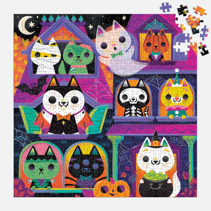 Close-up crop of the box art showing another group of cats in costume, with bats and cobwebs.