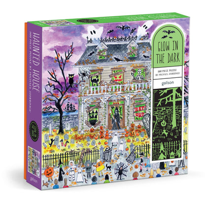 Box for the Michael Storrings Haunted House puzzle, angled to show the purple artwork front and a green “Glow in the Dark” label down the side.