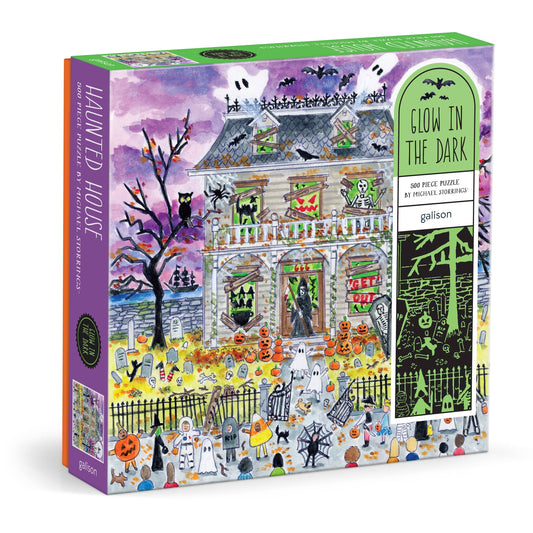 Box for the Michael Storrings Haunted House puzzle, angled to show the purple artwork front and a green “Glow in the Dark” label down the side.