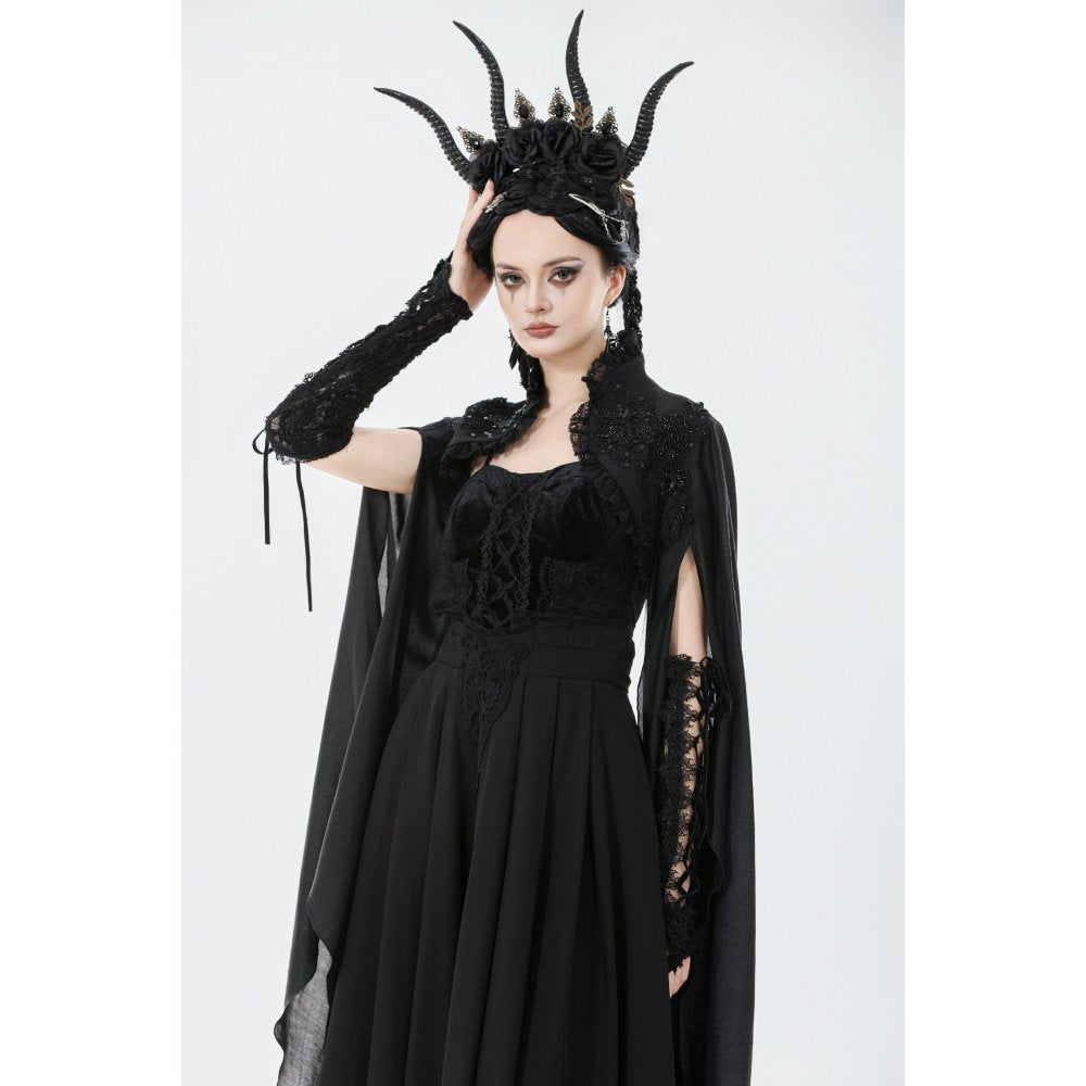 Close-up of lace trim and embroidery on black shrug