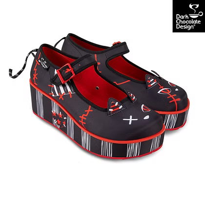 Black and red platform shoes with a unique cat design 