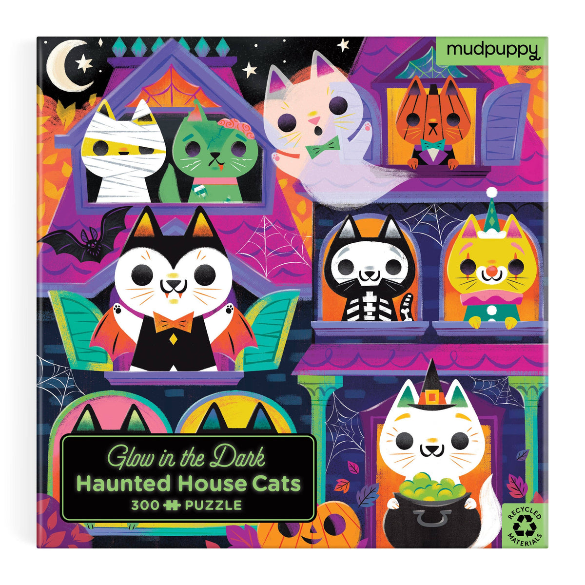 Close-up crop of the box art showing three cats dressed as a witch, a ghost and a black cat.
