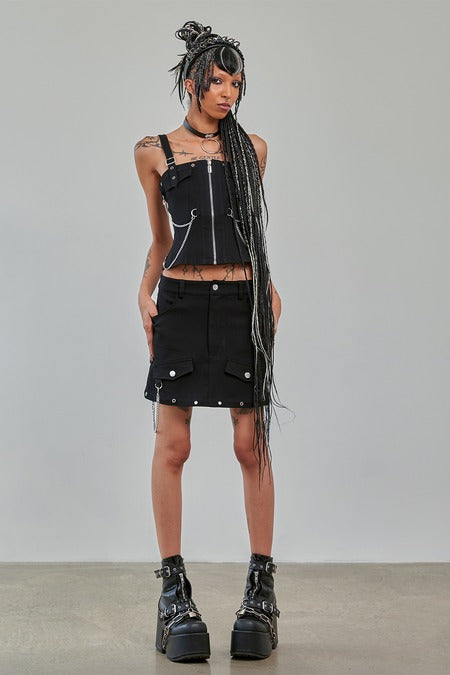Gothic Cargo Skirt black zip-off design worn with punk style outfit featuring utility pockets and bold accessories.