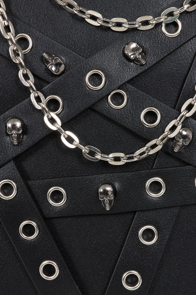 Banned Apparel Heartbreaker Harness Anatomical Heart Backpack closeup showing the skull suds, eyelets and chains