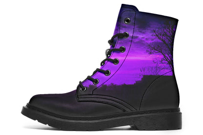Black boot with a purple tree design on a white background