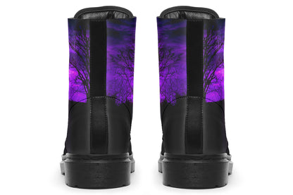 Black boots with a purple tree design on a white background