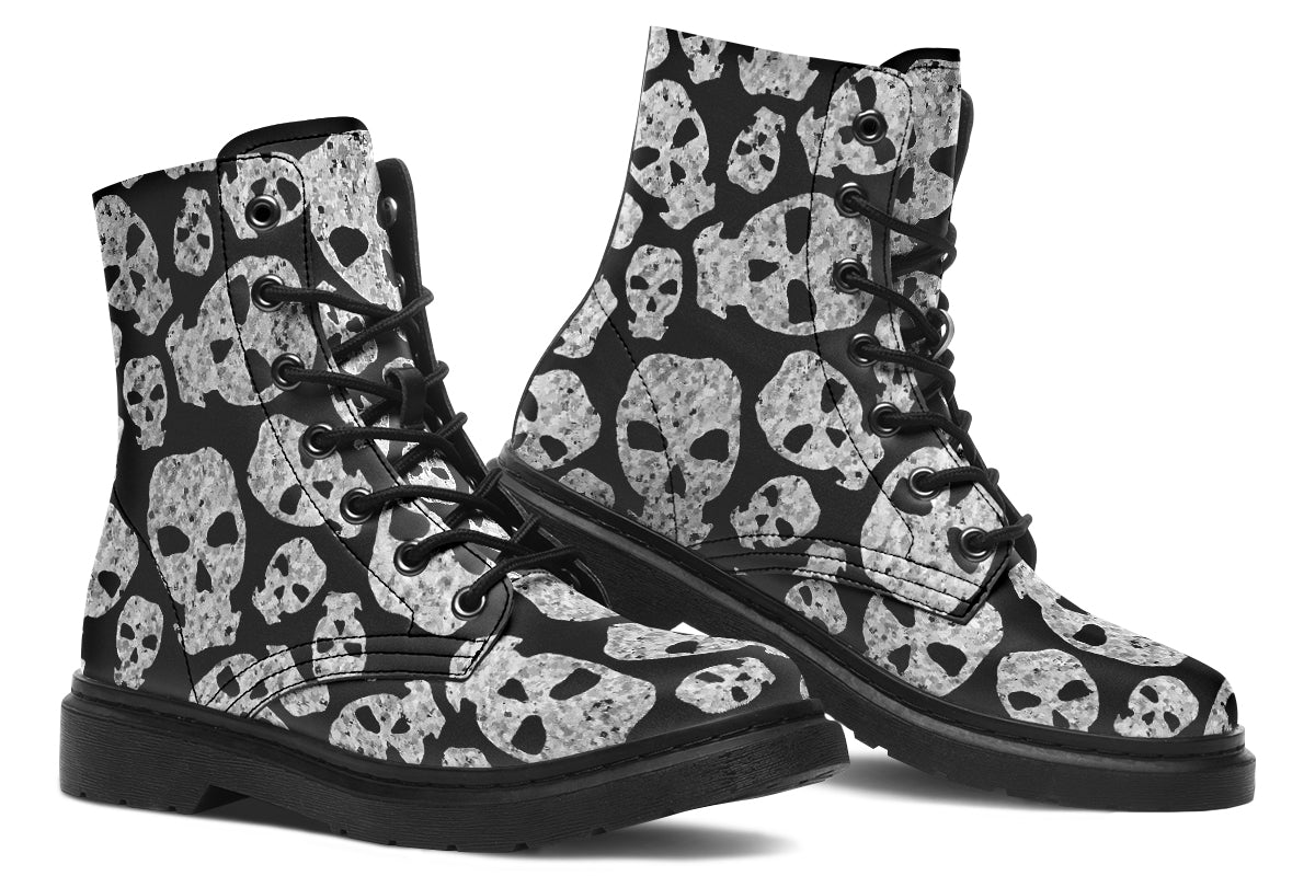 Black boots with skull pattern on a white background