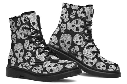 Black boots with skull pattern on a white background