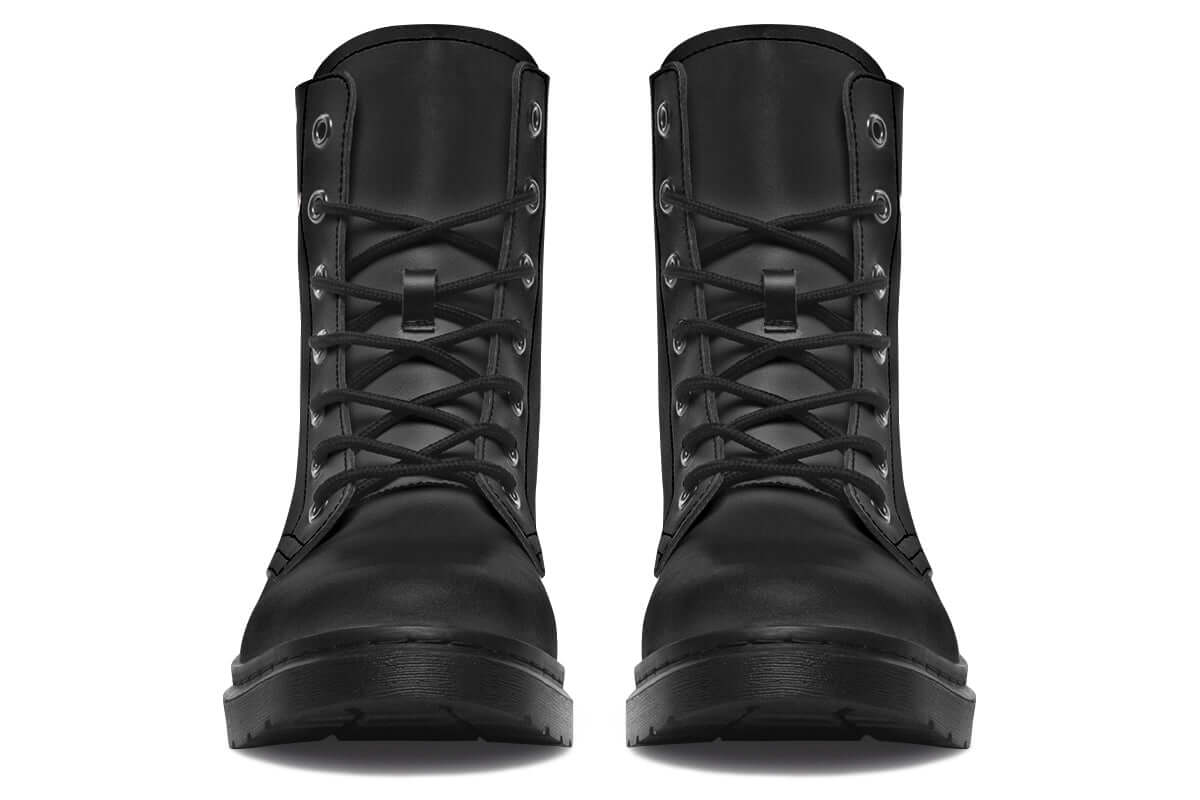 Pair of black combat boots on a white background