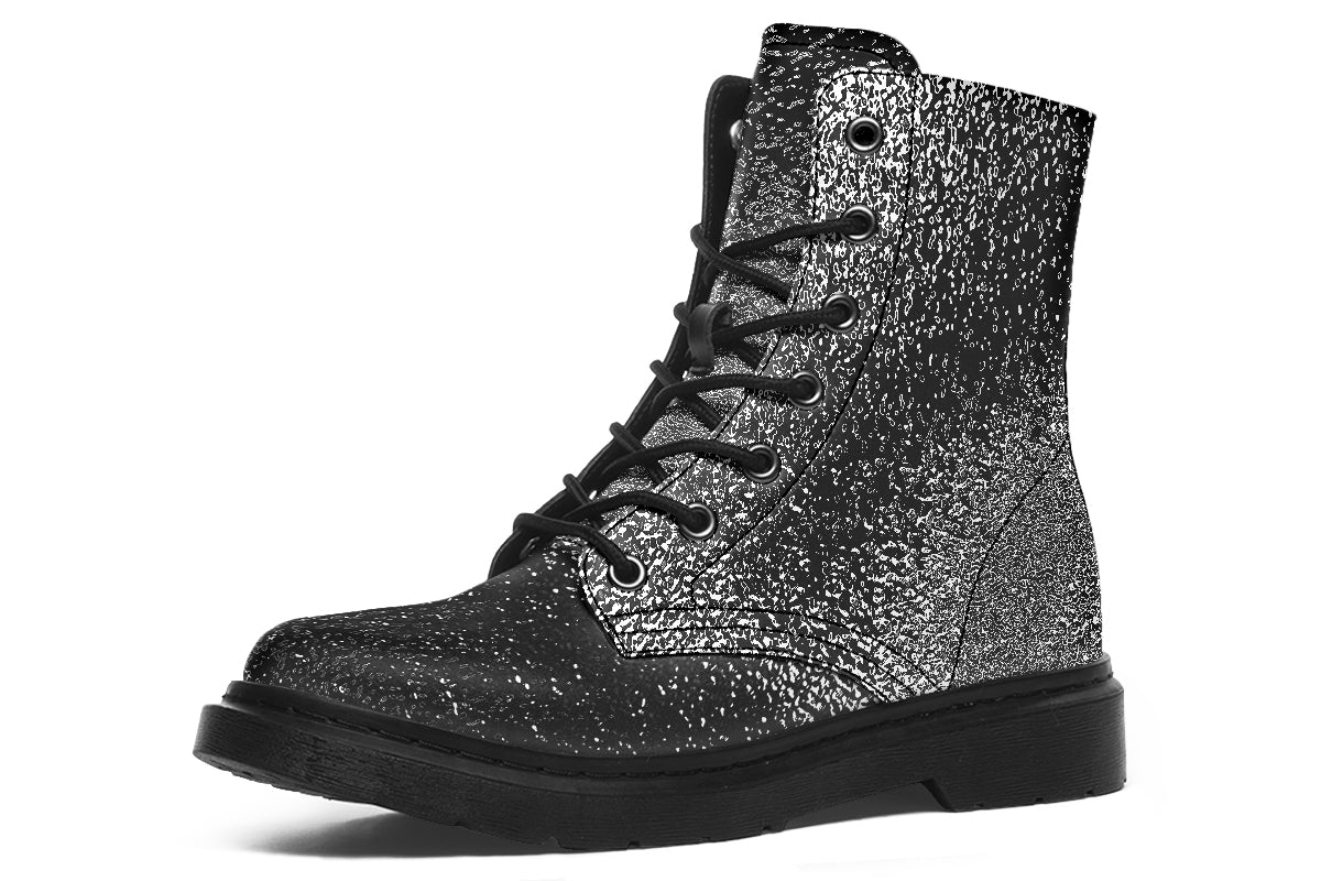 Black and silver glittery boot on a white background