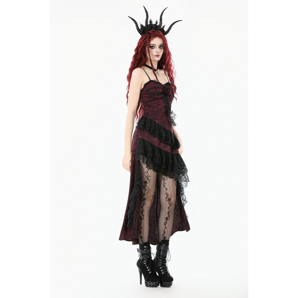 Woman wearing a black and red dress with lace details on a white background