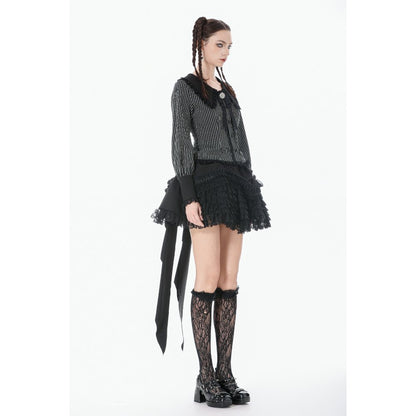 Person wearing a gothic-style outfit with a lace top, skirt, and stockings on a white background