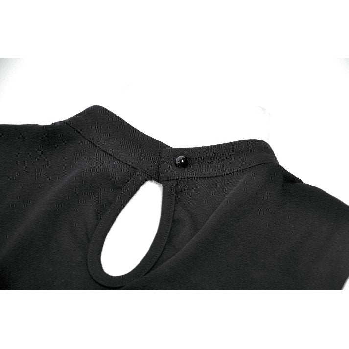 Close-up of a black shirt collar with a button on a white background