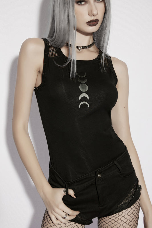 Model wearing a goth moon vest featuring moon phase print, styled with dark accessories and black shorts.