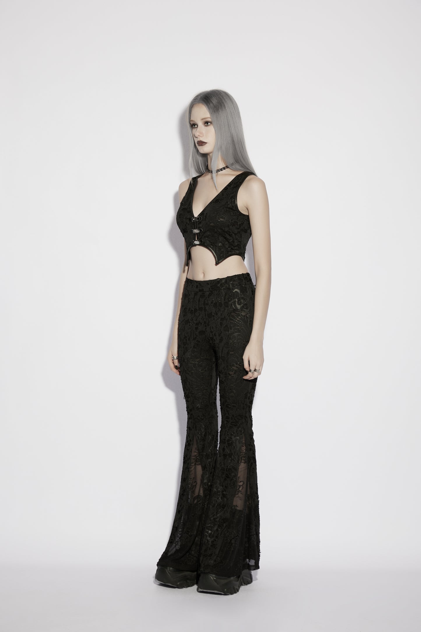 Model wearing Punk Rave Morticia Jacquard Flared Pants, showcasing gothic style and elegance in a modern design.