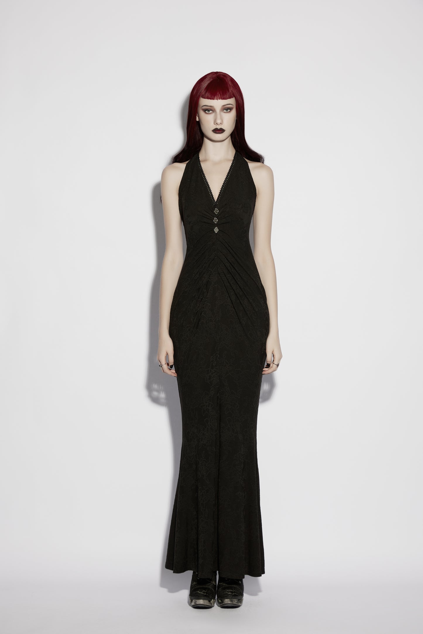 Model wearing Punk Rave Seraphina Jacquard Halter Fish Tail Dress featuring a deep halter neckline and dramatic fishtail hem.