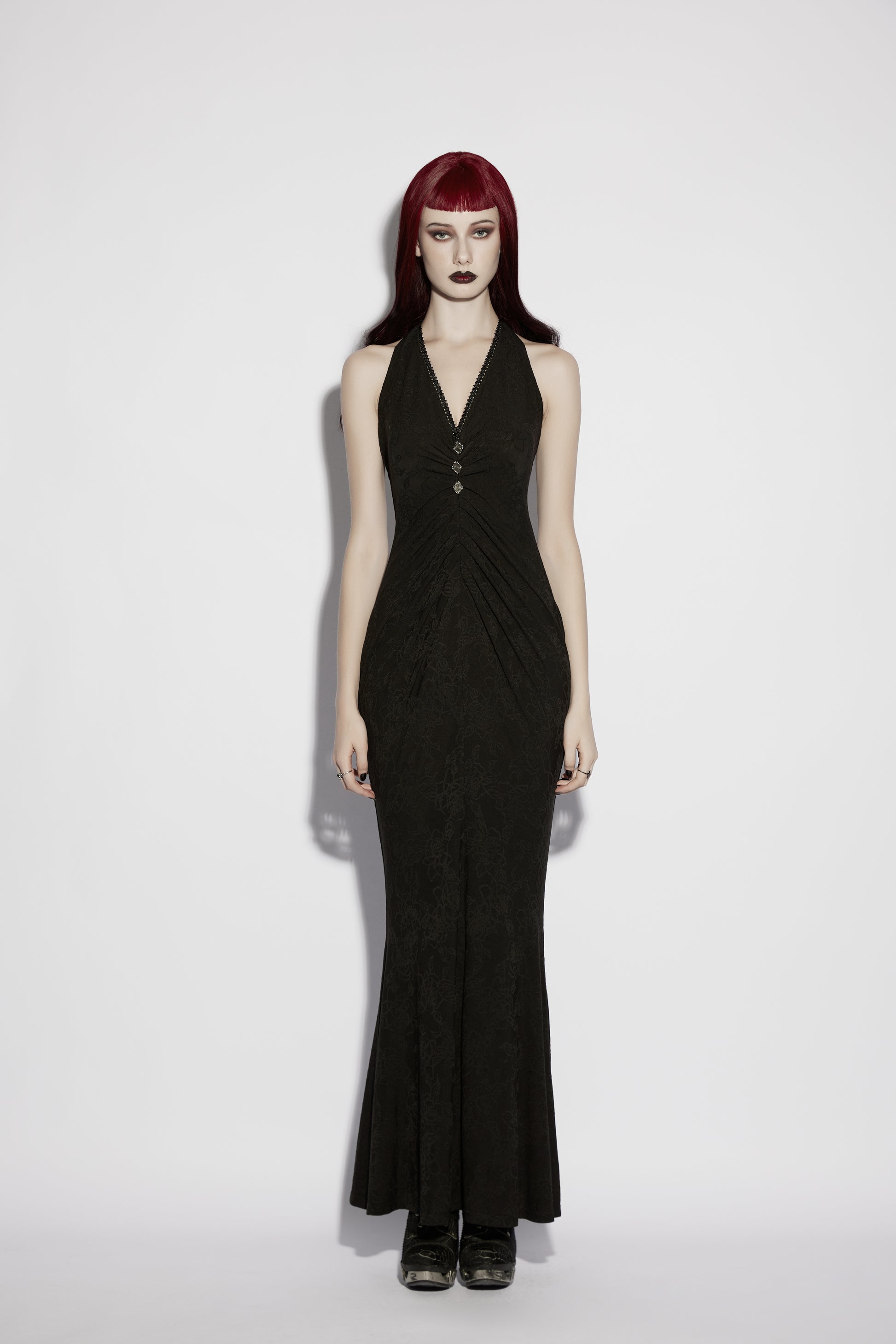 Model wearing Punk Rave Seraphina Jacquard Halter Fish Tail Dress featuring a deep halter neckline and dramatic fishtail hem.