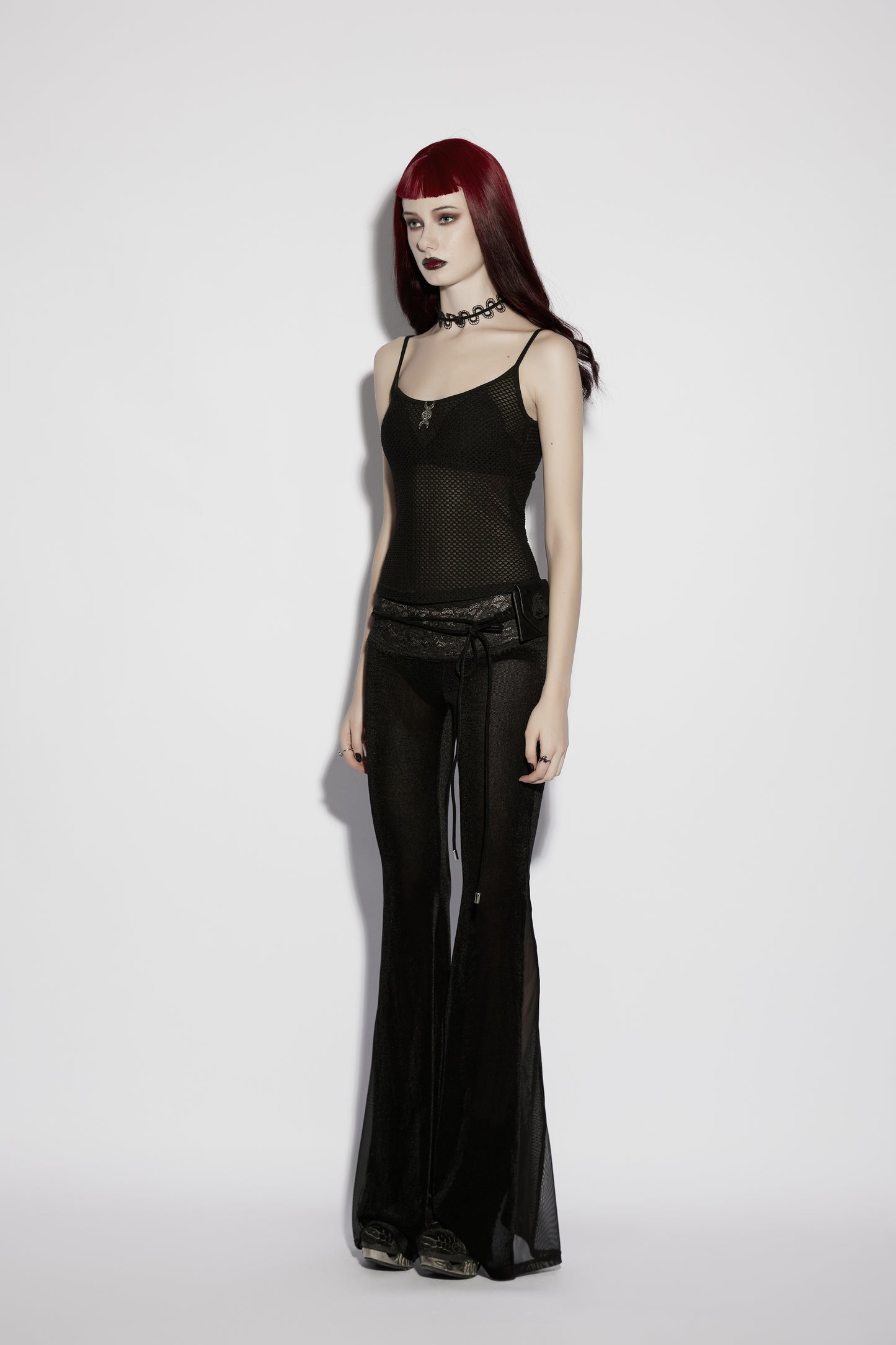 Model wearing a mesh goth camisole, showcasing the Punk Rave Nyx sheer cami top with a minimalistic, edgy look.