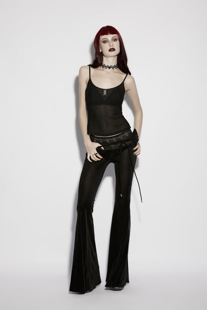 Model wearing a mesh goth camisole with dark flared pants, showcasing punk style and gothic fashion.